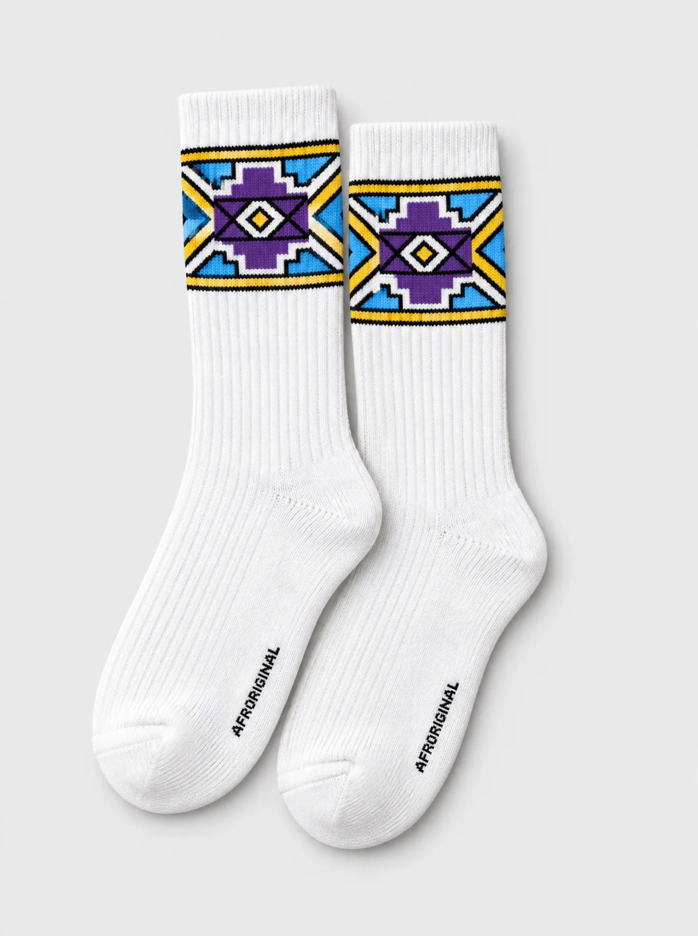 White ribbed crew socks with an Ndebele-inspired geometric cuff band